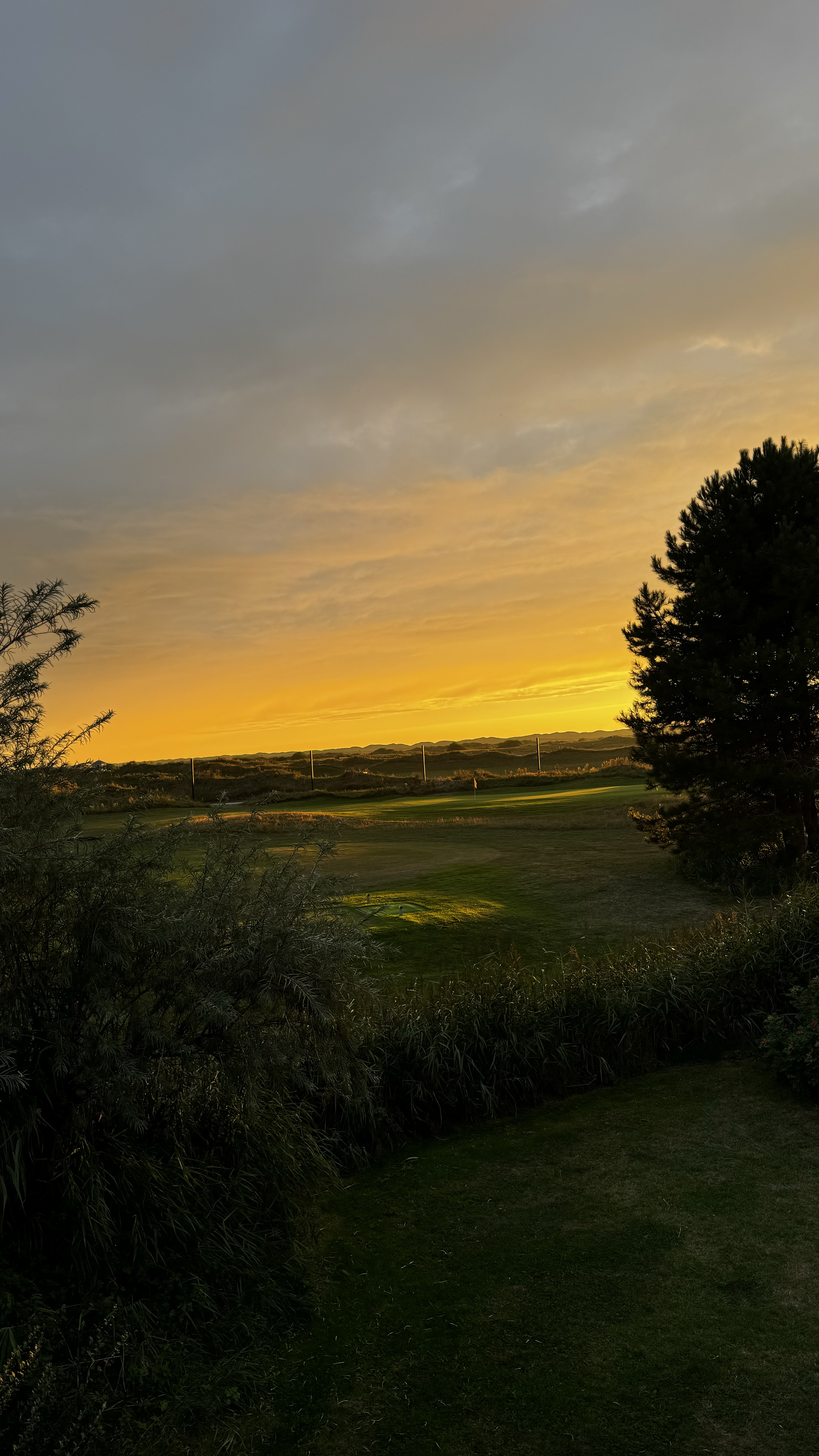 Zonsondergang golfbaan
